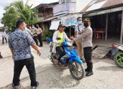 Kapolsek Rangsang Bagikan Puluhan Masker Kepada Masyarakat